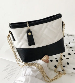 Inclined shoulder bag